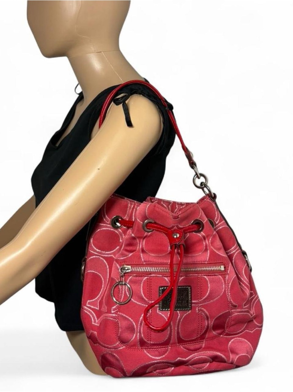 Red Coach poppy signature lurex drawstring bag.